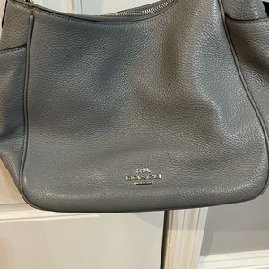 Coach bag. Barely used small hole in side pocket. Clean on the inside.